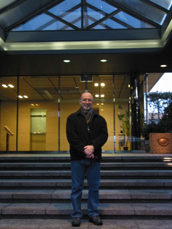 Michael Busha standing at the entrance of a building in Kobe